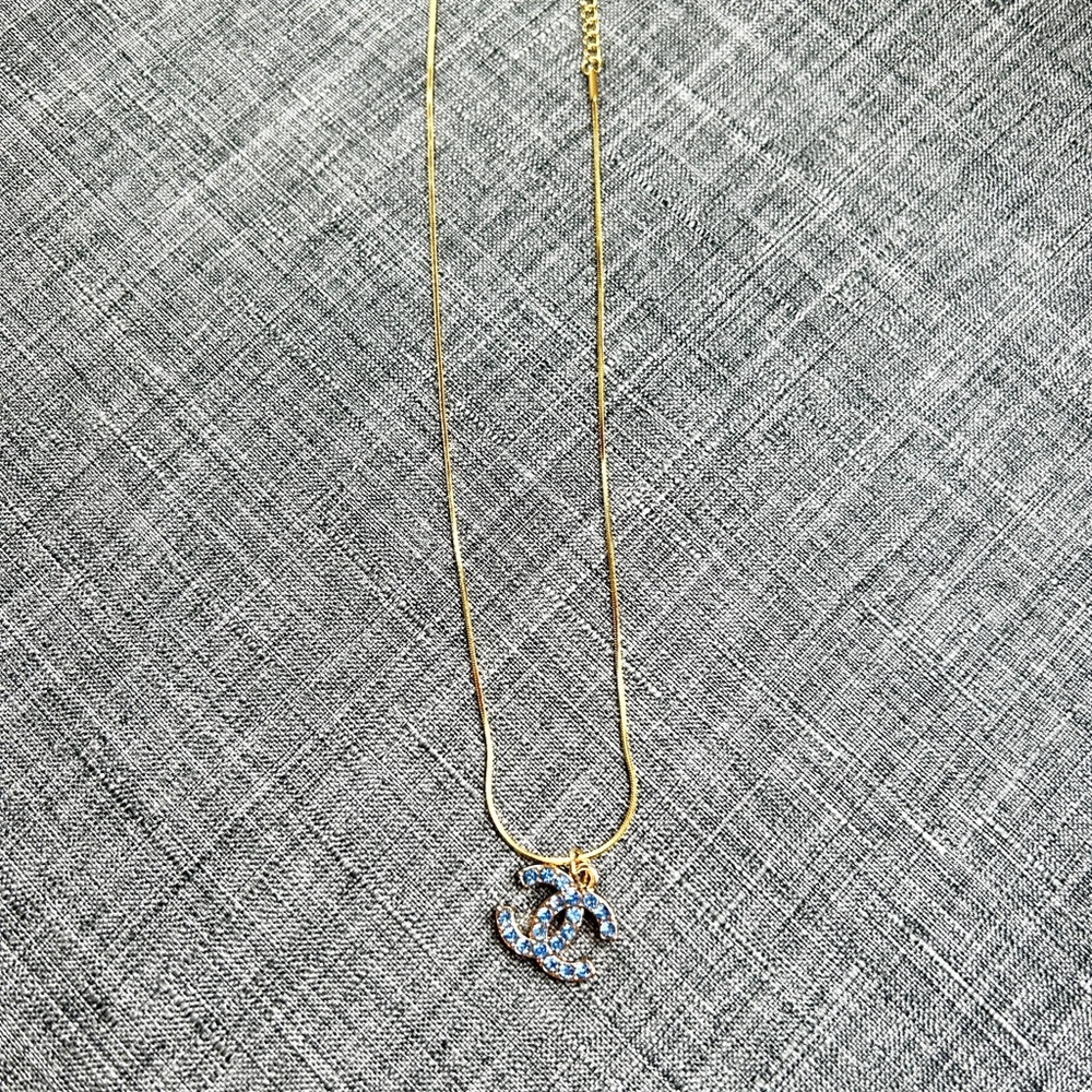 Coco Chanel Blue/Gold Double C women’s necklace on a gold 14 inch chain